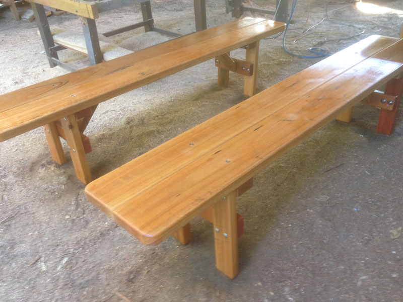 Two small basic bench seats for outdor use