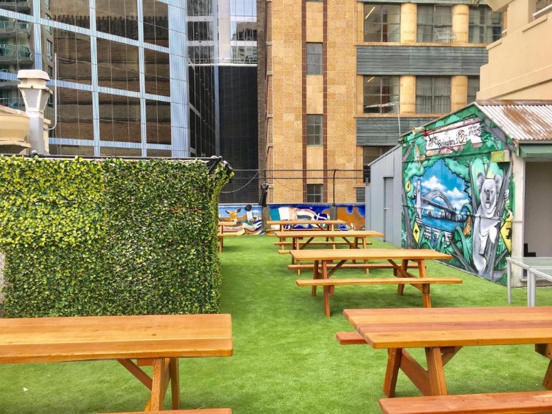 Picnic tables on the roof at Mad Monkey Backpackers