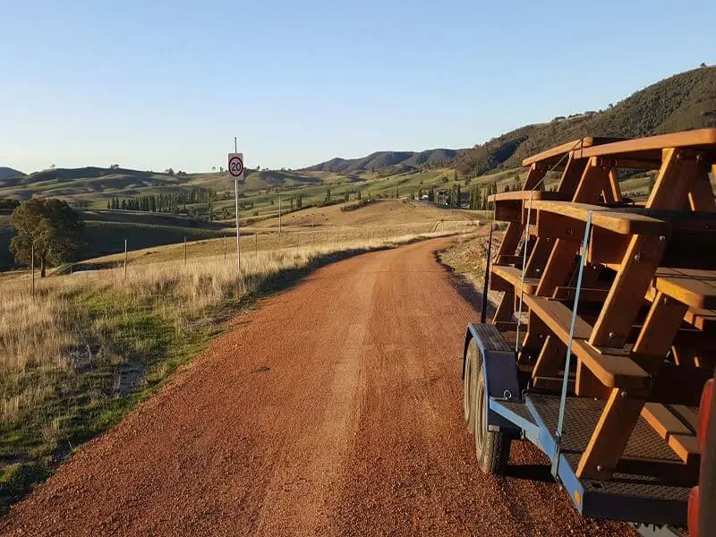 Billabong hardwood picnic tables secured on a delivery truck