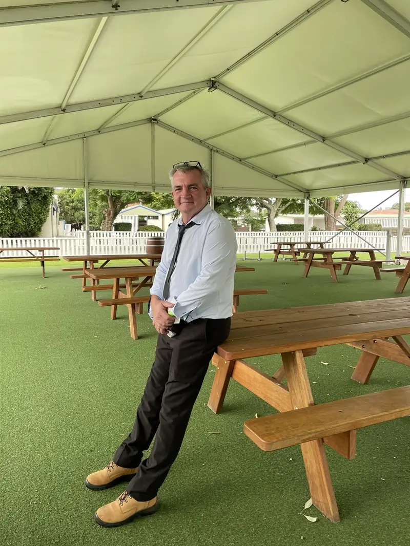 David James standing among Billabong picnic tables at the Gold Coast Turf Club