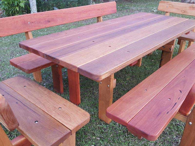 close up view of a five piece hardwood patio setting