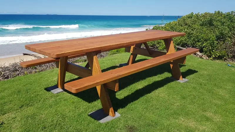 Restored Billabong hardwood picnic table beside the beach