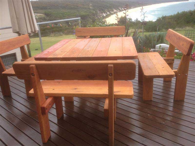 Square five piece picnic table on a balcony with a view