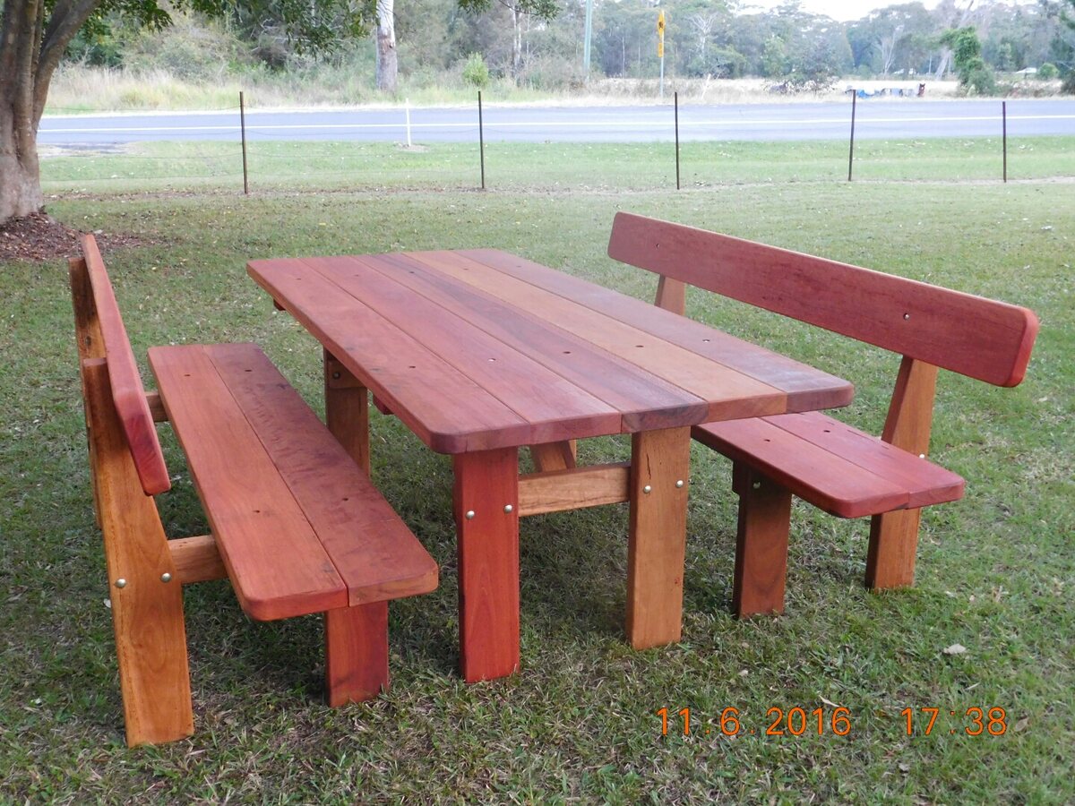 Comfortable hardwood picnic table with separate backrest benches